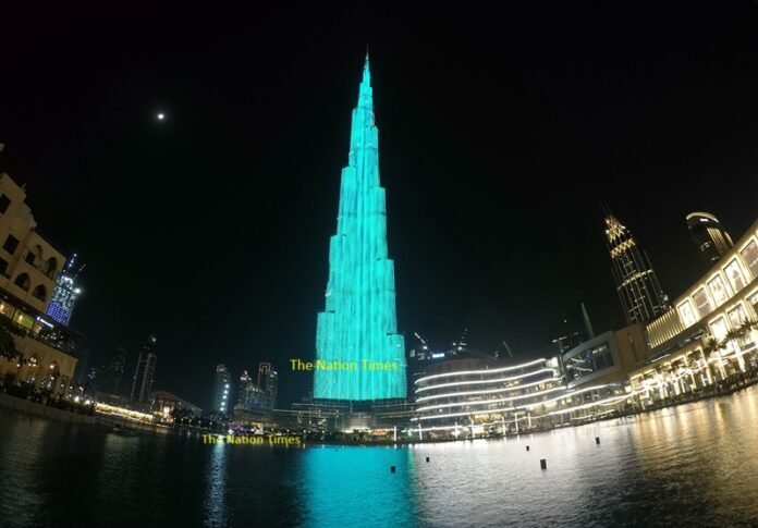 UAE-DUBAI-BURJ KHALIFA-LIGHT SHOW चिंताजनक असर! इजरायल-ईरान युद्ध से दुबई रियल एस्टेट बाजार में गिरावट की आशंका Dubai Real Estate Market Israel Iran War